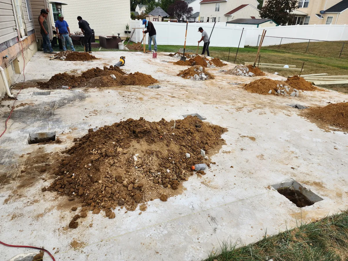 TWO MEN crew working on outdoor property project in Delaware