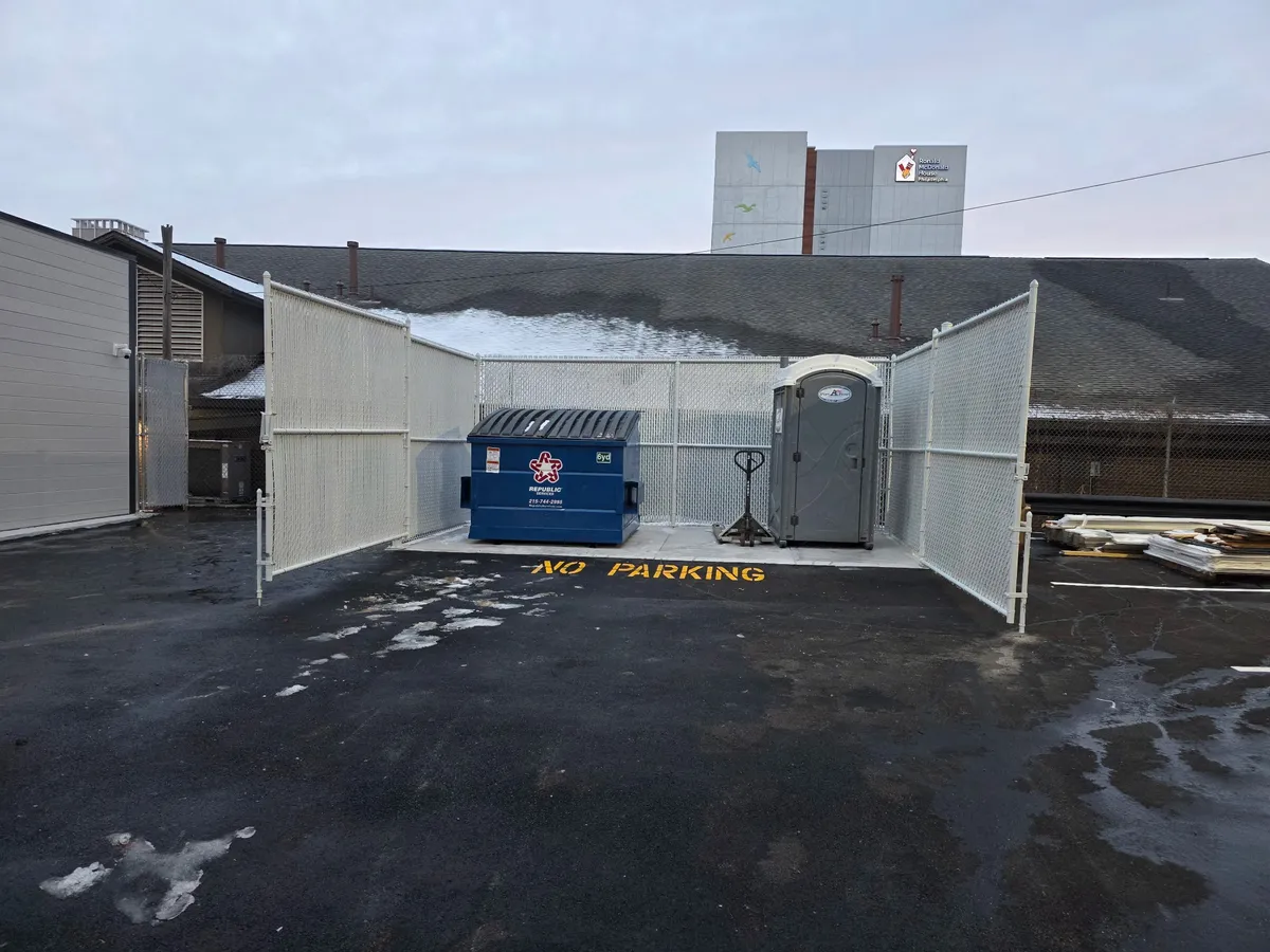 Vinyl dumpster enclosure at commercial property